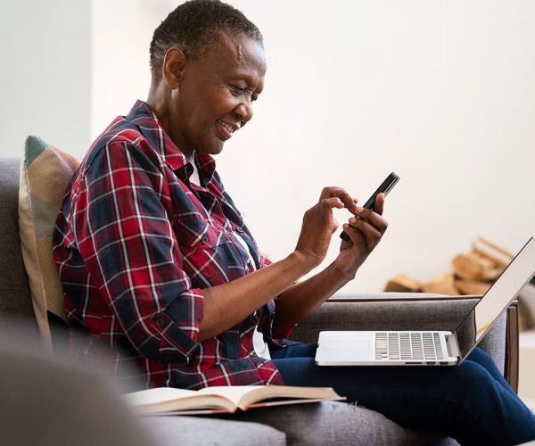 Woman buying electrcity from the comfort of her home using the PayPulse app